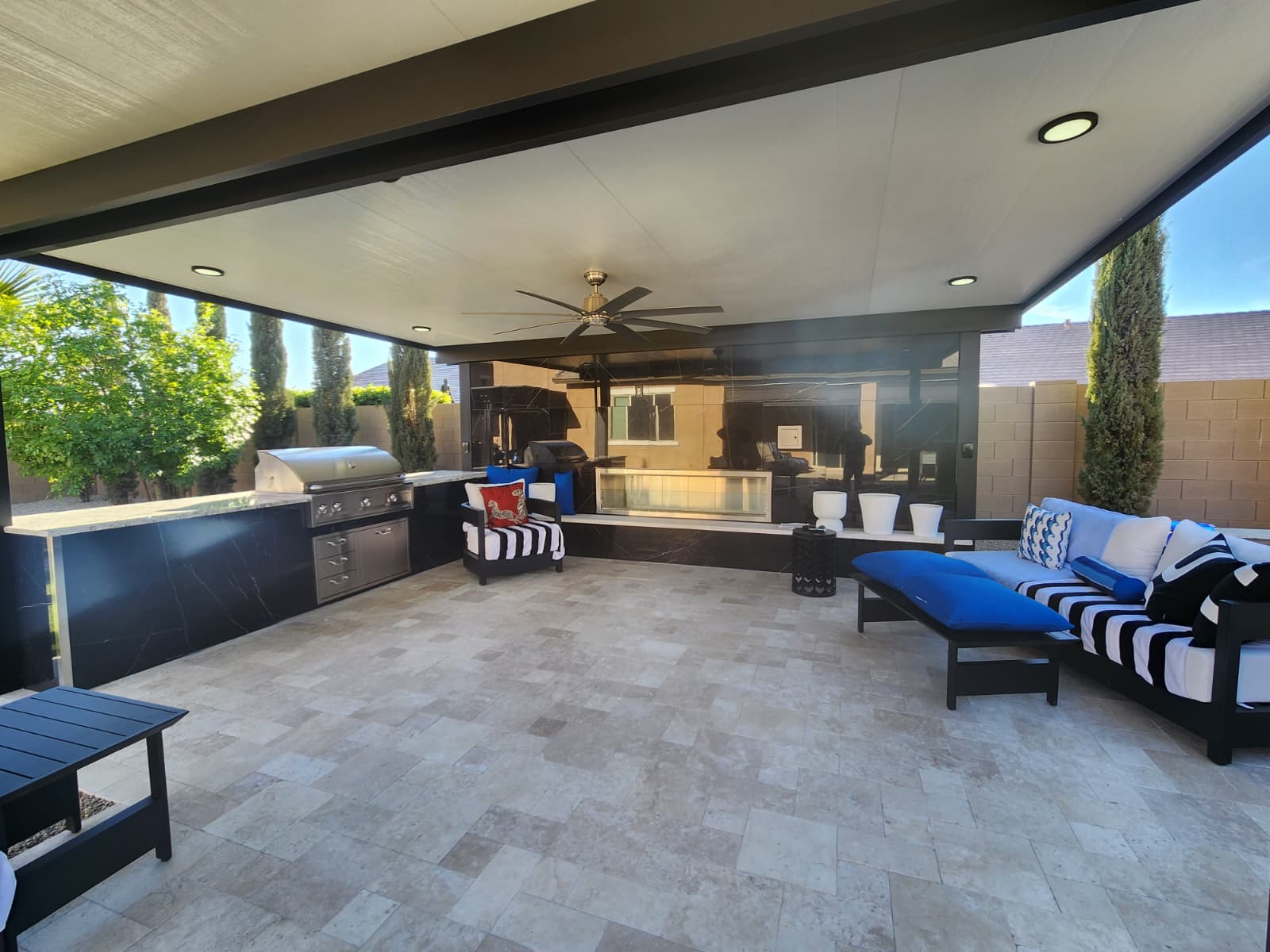 Covered patio with travertine and BBQ area