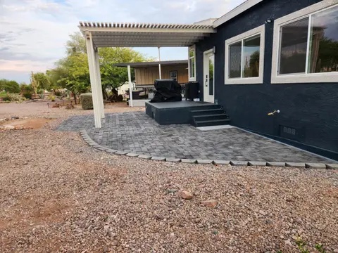 Covered patio with wood canopy and paver flooring