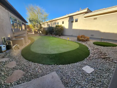 Putting green installation with synthetic turf