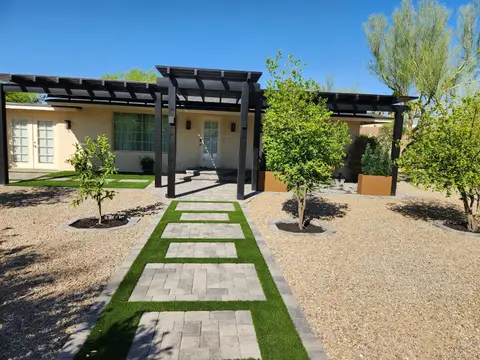 Front walkway combining pavers and turf grass